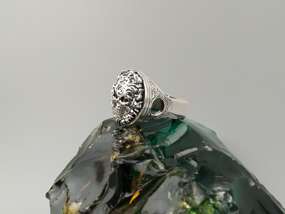 Blazing sterling silver skull ring, angled view of top and shoulder