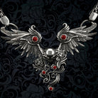 Close-up of Dark Angel necklace: feathered silver wings, central skull, roses and red cubic zirconia