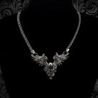 Dark Angel gothic skull and wings necklace on a black bust, full woven silver chain