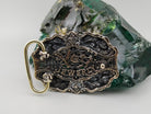 Eternal Conqueror buckle angled view, silver cross over skulls