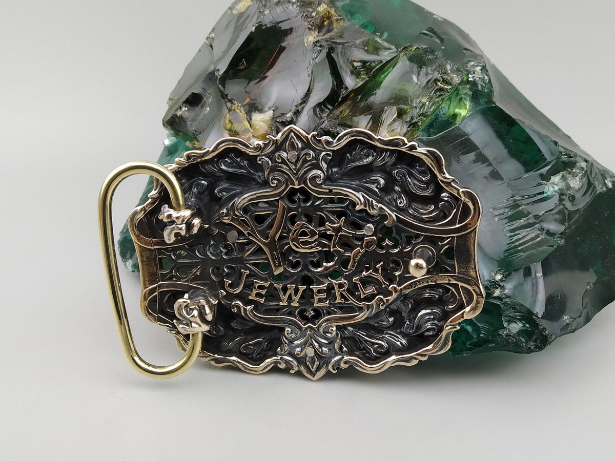 Eternal Conqueror buckle angled view, silver cross over skulls