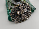 Cross and skulls buckle detail with oxidized ornament