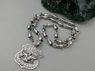 Forcer biker chain shown with a silver badge pendant