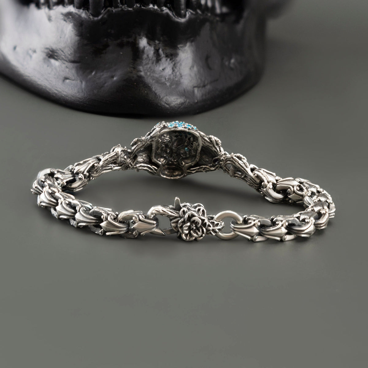 Frida skull bracelet laid out showing ornate links and the rose clasp