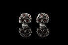 Frida red CZ skull studs side by side, front view with reflection