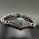 Close-up of the turquoise stone sugar skull with flower crown on the Frida bracelet