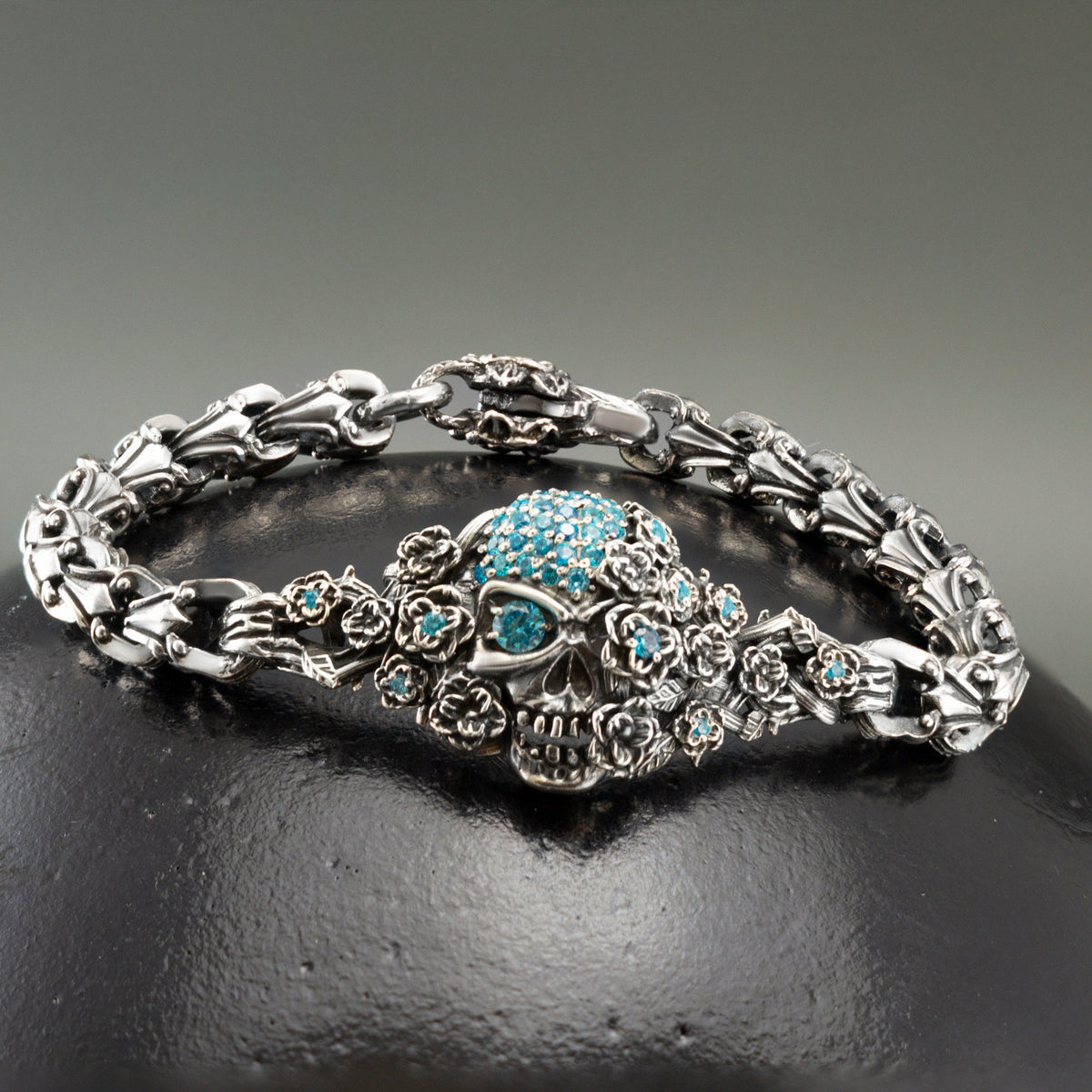 Close-up of the turquoise stone sugar skull with flower crown on the Frida bracelet