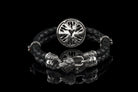 Back of the silver skull medallion and sculpted clasp on the black braided leather bracelet