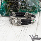 Garry bracelet on white wood showing the clasp and skull ends
