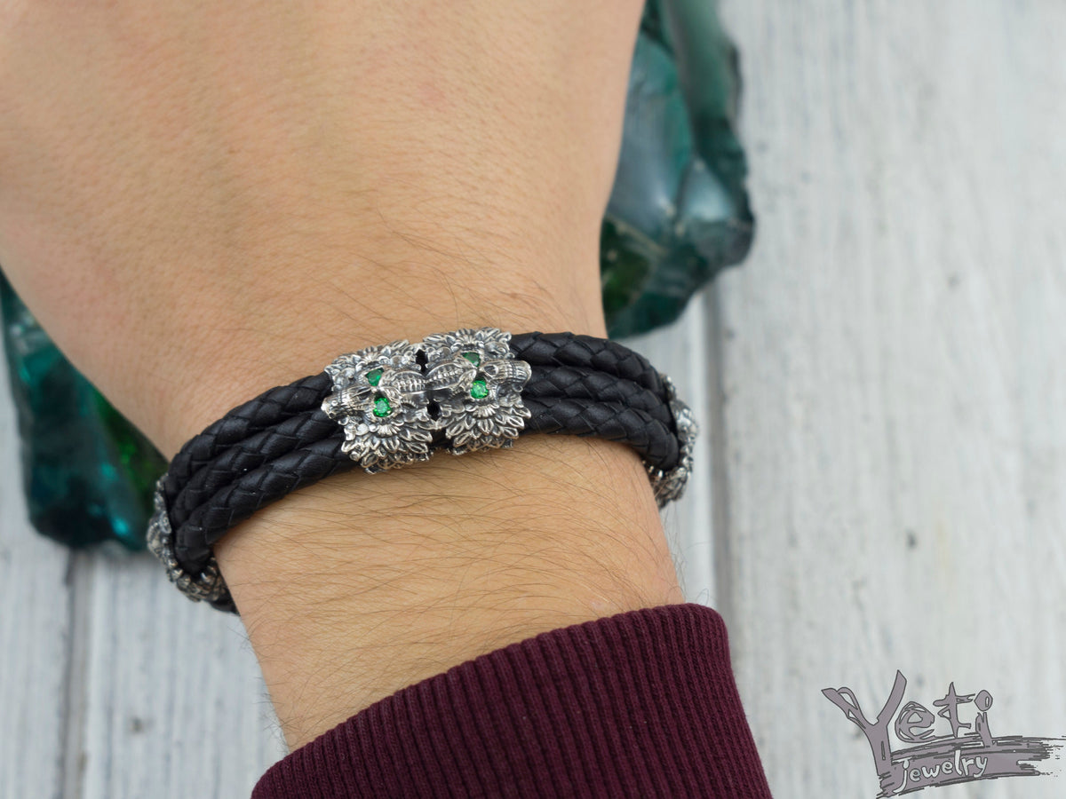 Garry braided leather skull bracelet worn with a burgundy sweater