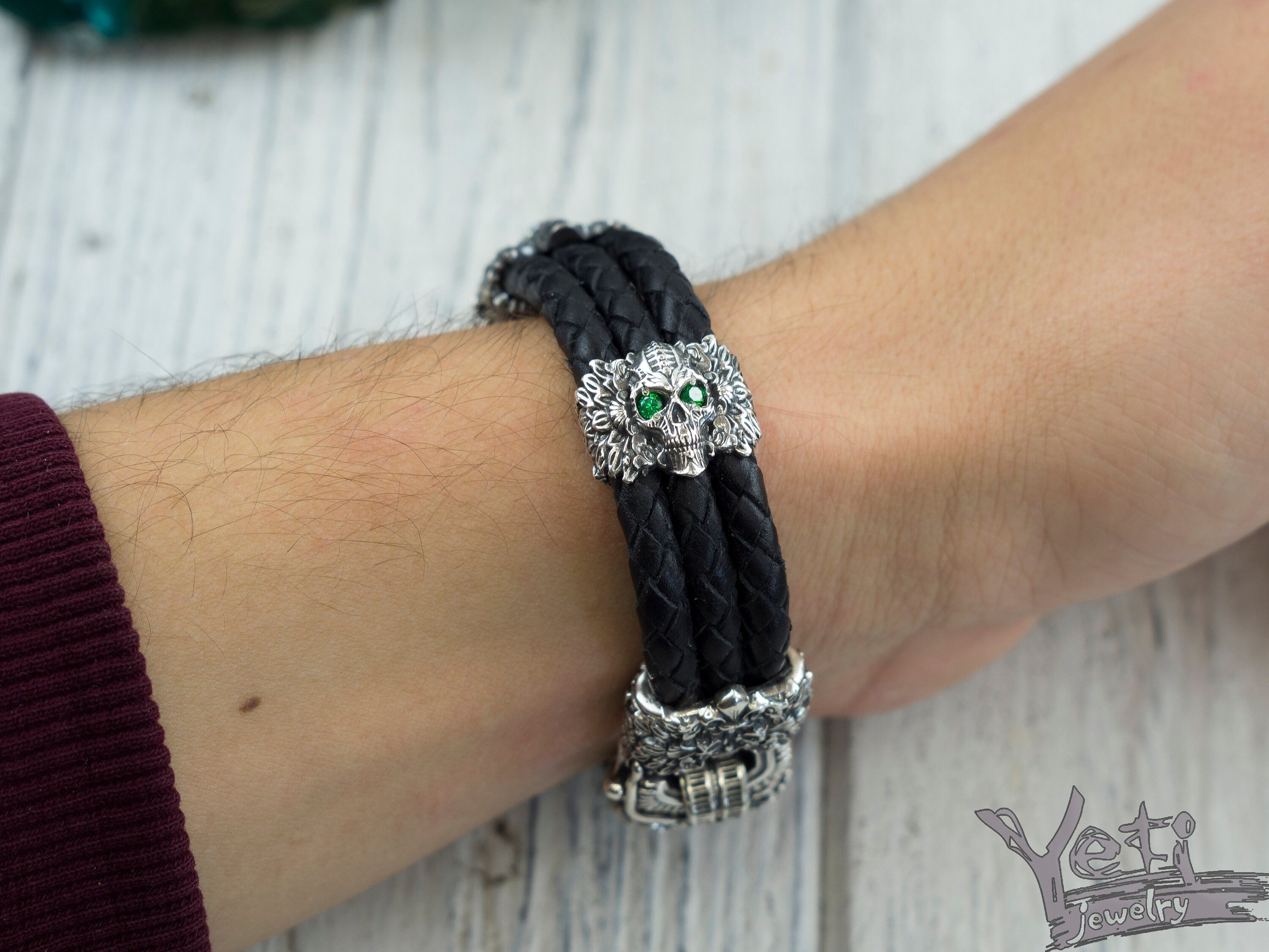 Garry skull bracelet worn on a man's wrist, top view