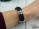 Garry skull bracelet worn on a man's wrist, top view
