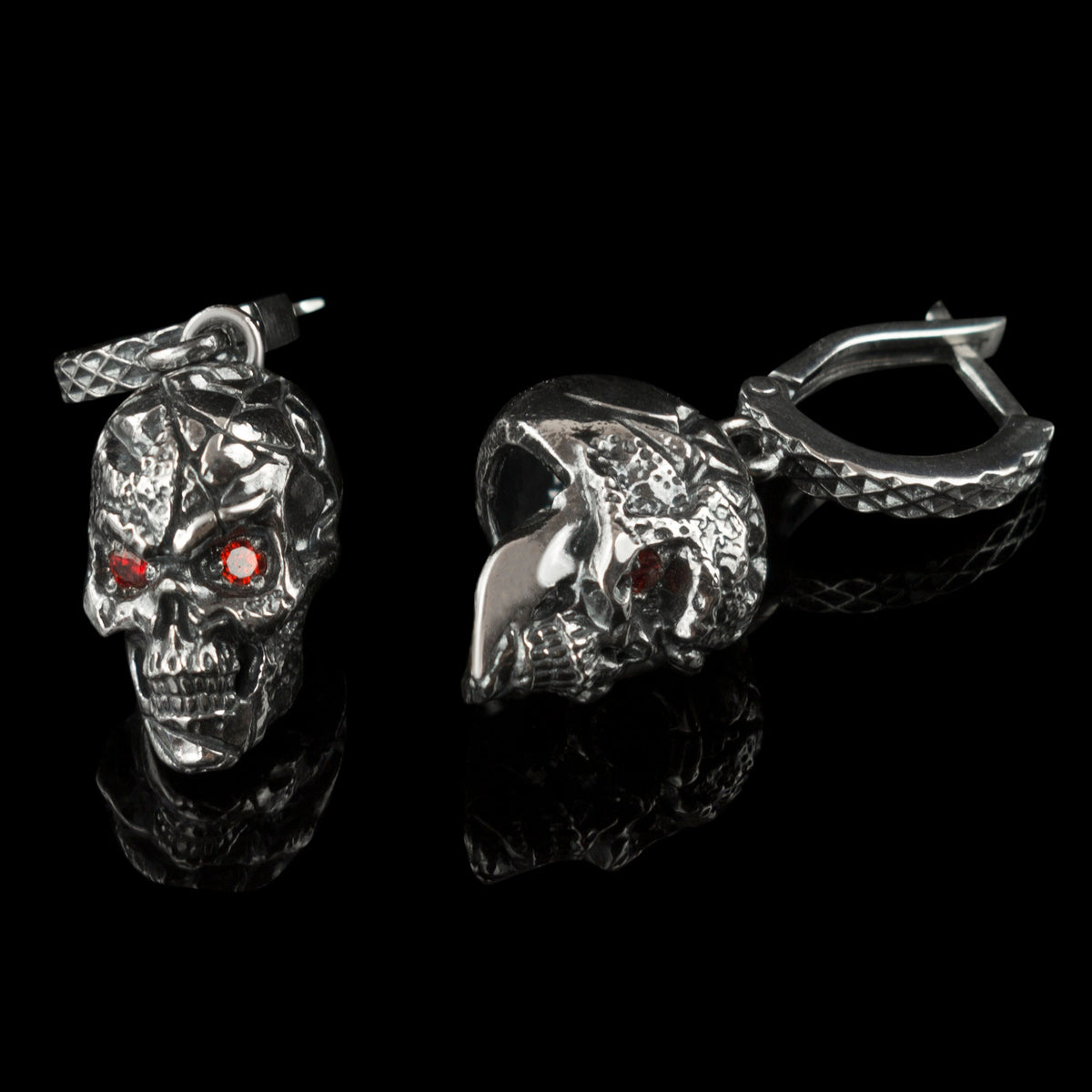 Headhunter skull drops front and side view with red stone eyes