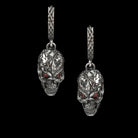 Headhunter skull earrings hanging side by side, front view