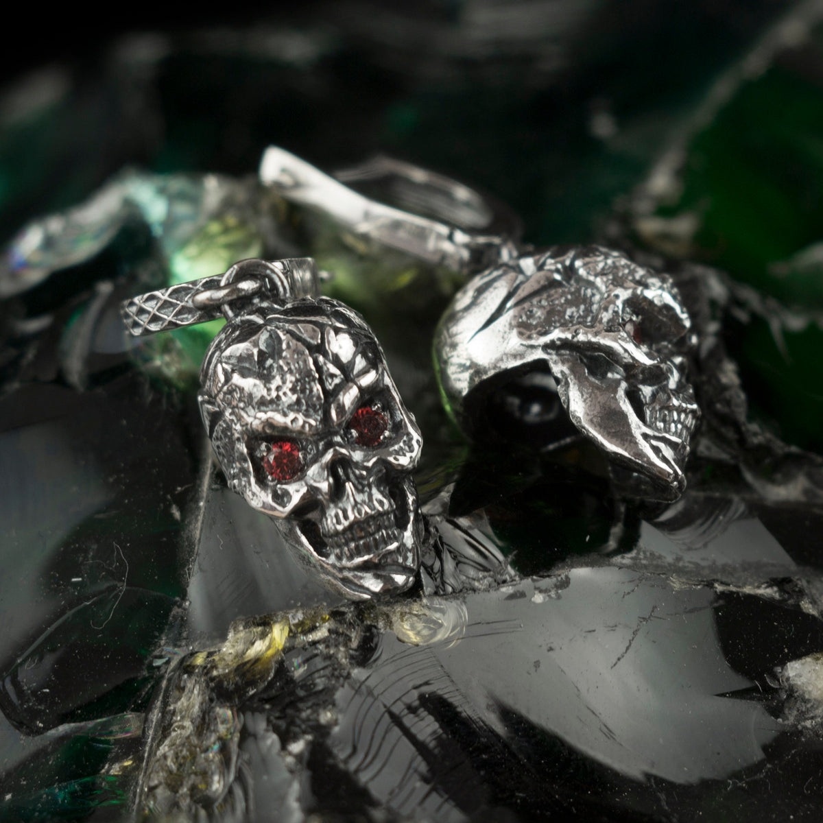 Headhunter skull sterling silver drop earrings with red cubic zirconia eyes
