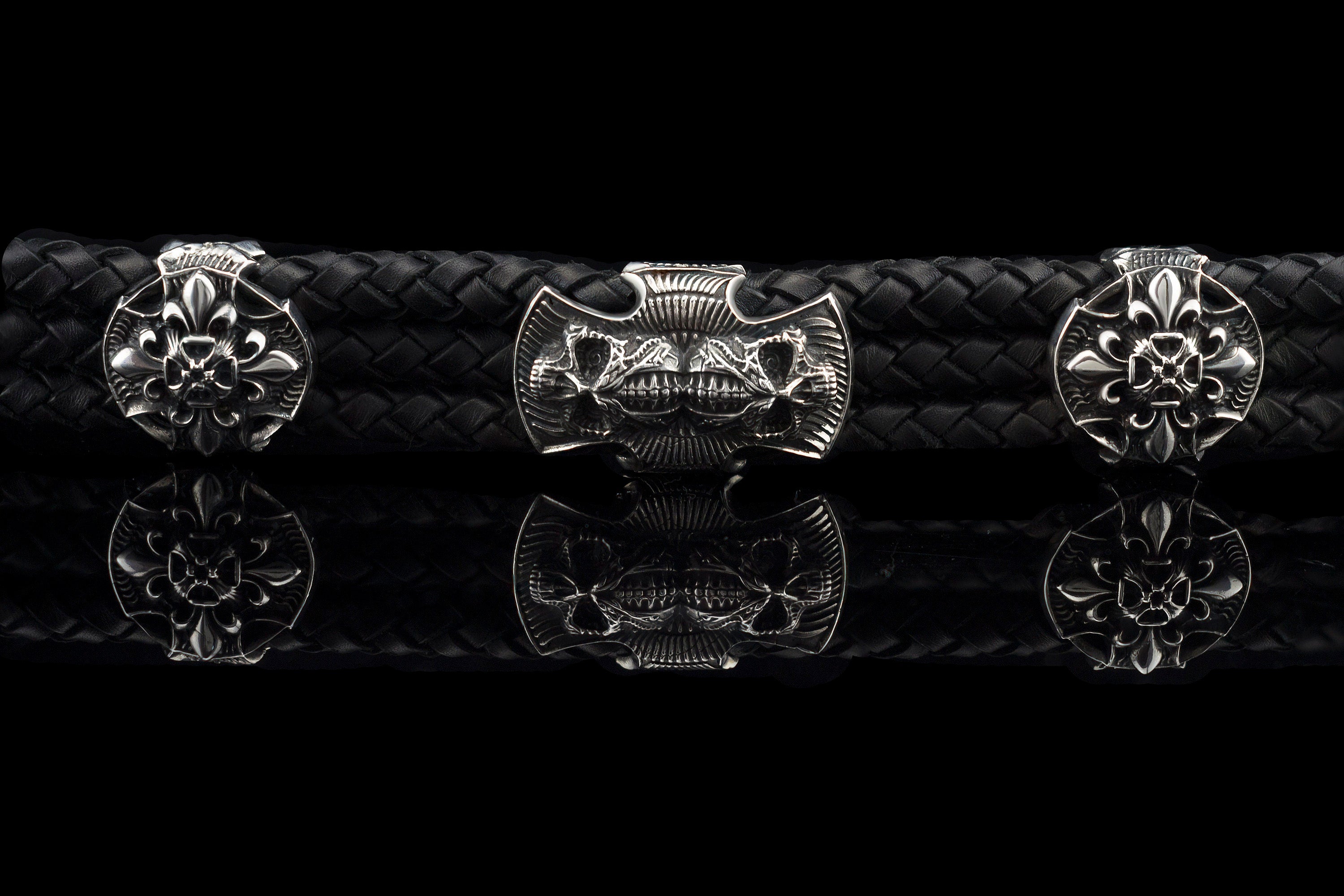 Heavy sterling silver skull bracelet on black braided leather, straight