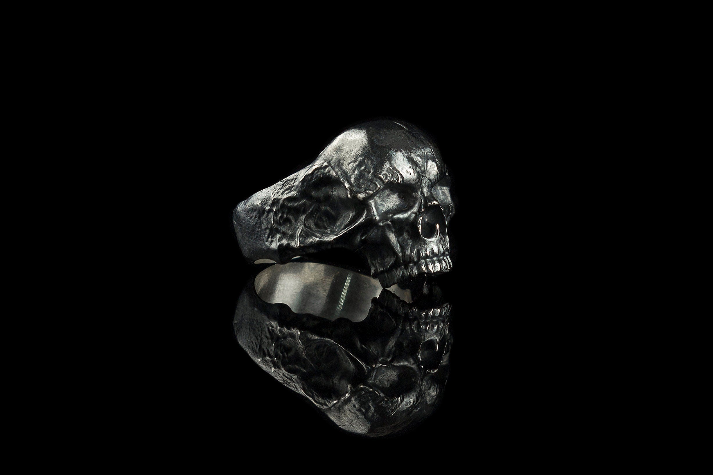 Hellbound heavy silver skull ring, right side view with oxidized cracked shank