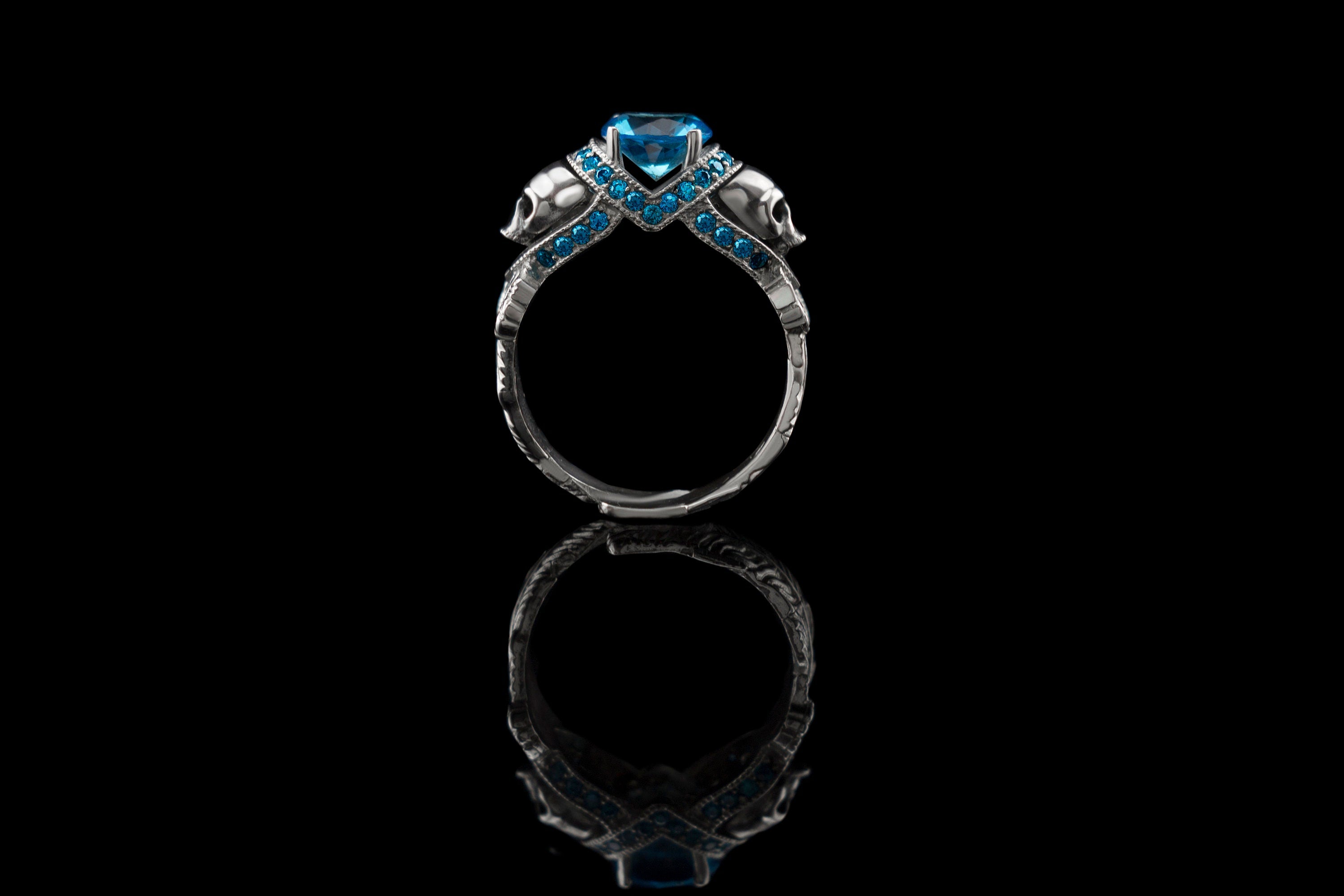 Atropos 925 sterling silver skull ring with blue cubic zirconia and double skull gothic design