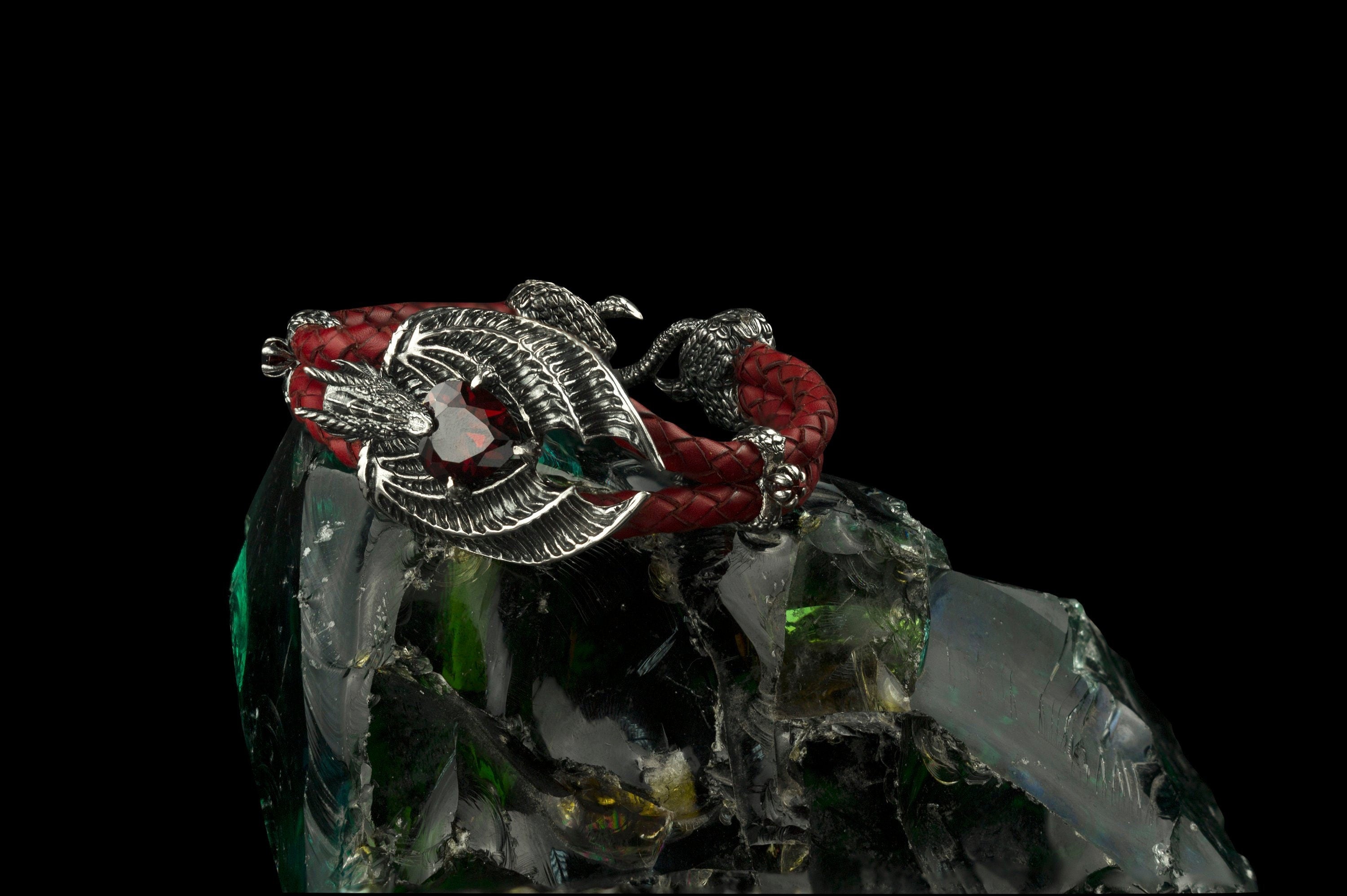 Dragon Heart bracelet with a sculpted sterling silver dragon, red garnet and braided red leather cord by Yeti Jewelry