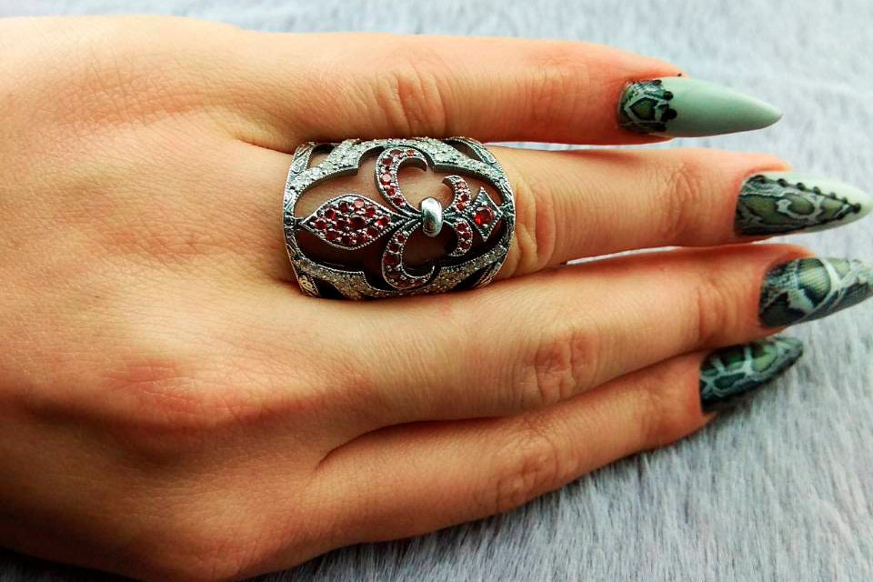 Handcrafted 925 sterling silver "Mary" wide band ring featuring a Fleur-de-Lis set with ruby red and clear pave cubic zirconia stones
