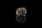 Handcrafted 925 sterling silver "Frida" skull ring wrapped in roses with sparkling crimson red cubic zirconia pave on a dark background