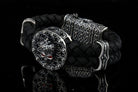 Crowned skull bracelet with 925 sterling silver details, genuine black braided leather and red cubic zirconia eyes