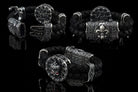 Crowned skull bracelet with 925 sterling silver details, genuine black braided leather and red cubic zirconia eyes