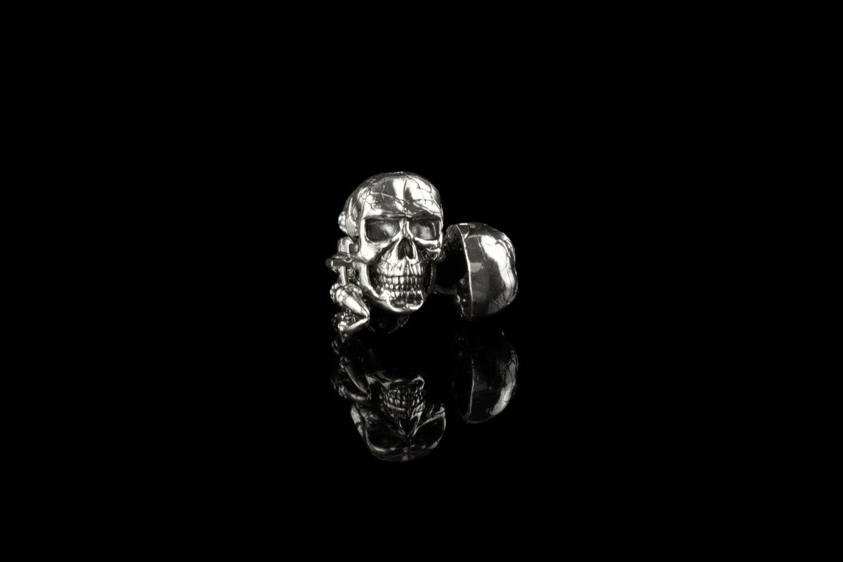 Close-up of Edward sterling silver skull cufflinks showing detailed skull relief