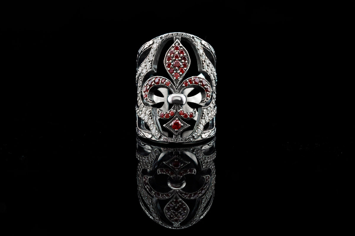 Handcrafted 925 sterling silver "Mary" wide band ring featuring a Fleur-de-Lis set with ruby red and clear pave cubic zirconia stones