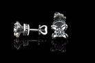 Handcrafted 925 sterling silver "Giona" stud earrings featuring sapphire blue cubic zirconia stones in sculpted claw settings with screw-back closures


