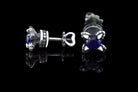 Handcrafted 925 sterling silver "Giona" stud earrings featuring sapphire blue cubic zirconia stones in sculpted claw settings with screw-back closures


