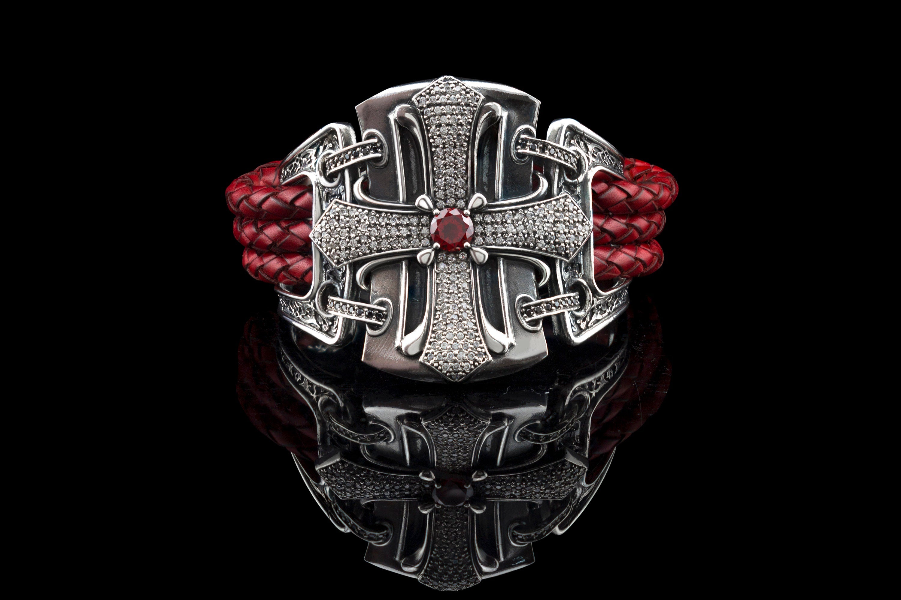 Gothic sterling silver cross bracelet with cubic zirconia, red center stone and red braided leather on black