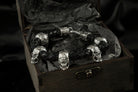 Wild 925 sterling silver skull bracelet with braided black leather band and multiple sculptural skulls

