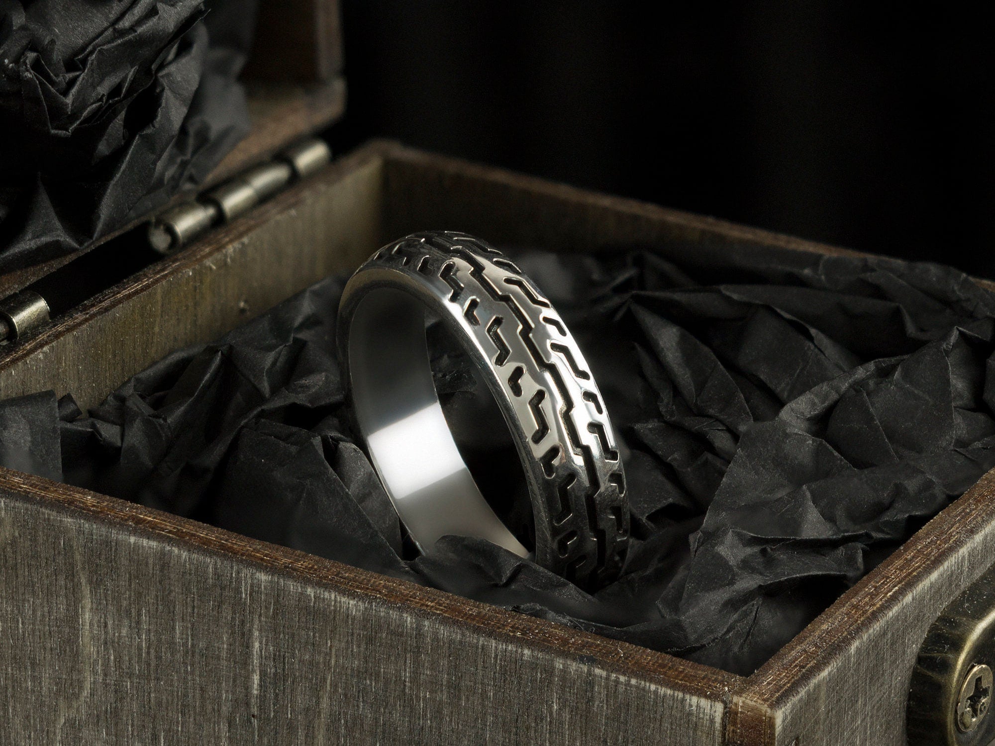 925 sterling silver motorcycle tire ring with deep geometric tread pattern and polished inner band