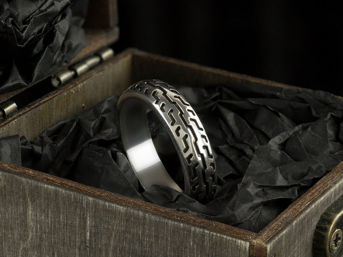 925 sterling silver motorcycle tire ring with deep geometric tread pattern and polished inner band