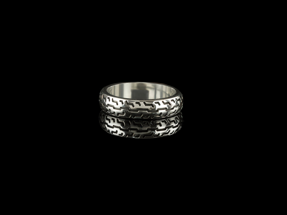 925 sterling silver motorcycle tire ring with deep geometric tread pattern and polished inner band