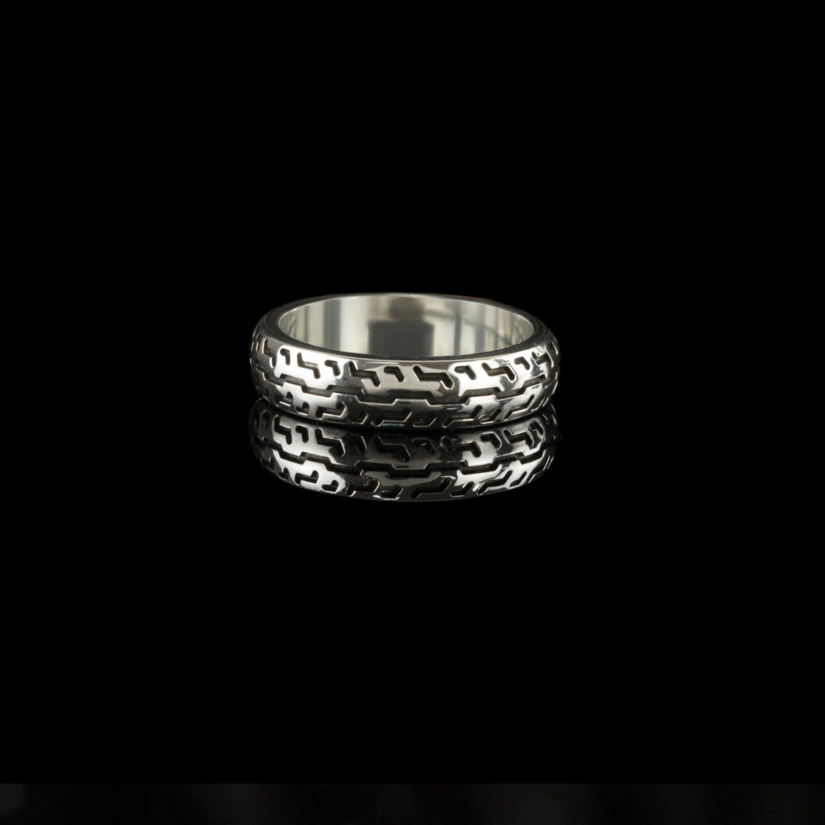 925 sterling silver motorcycle tire ring with deep geometric tread pattern and polished inner band