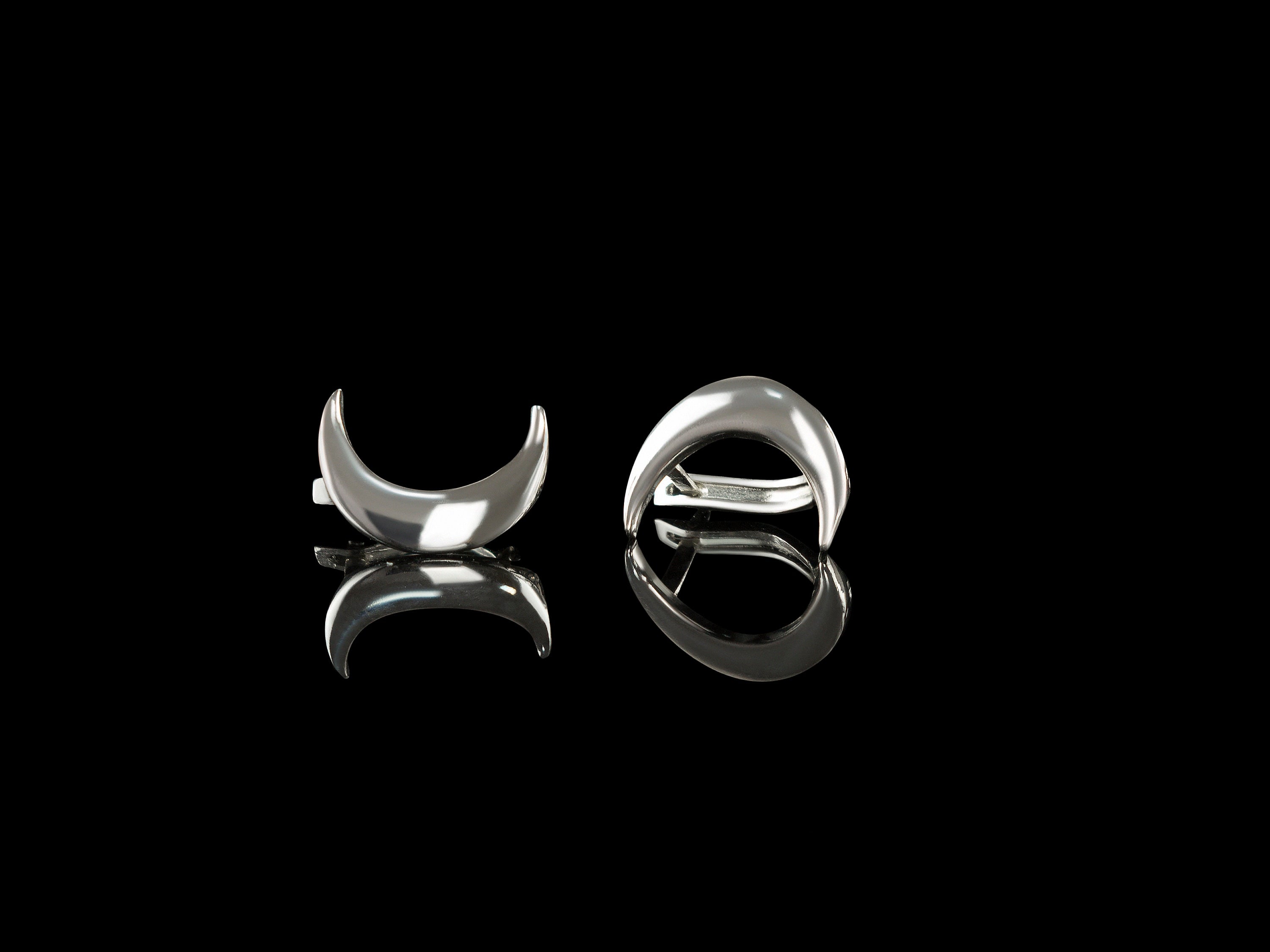 White Polish Moon 925 sterling silver crescent moon earrings with high-polish finish on a black background.