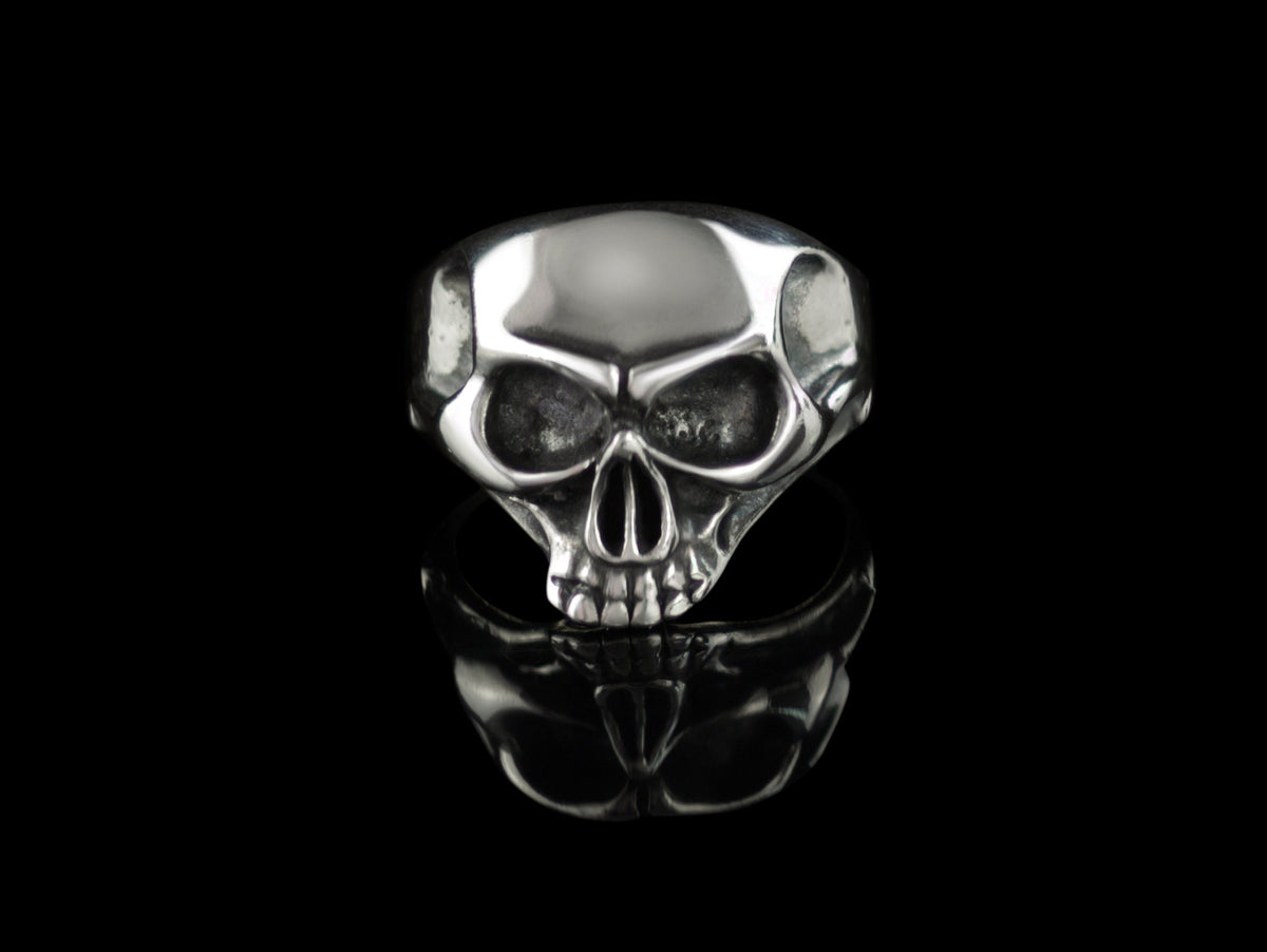 Beliar gothic skull ring handcrafted from 925 sterling silver with polished skull details, photographed against a black background.