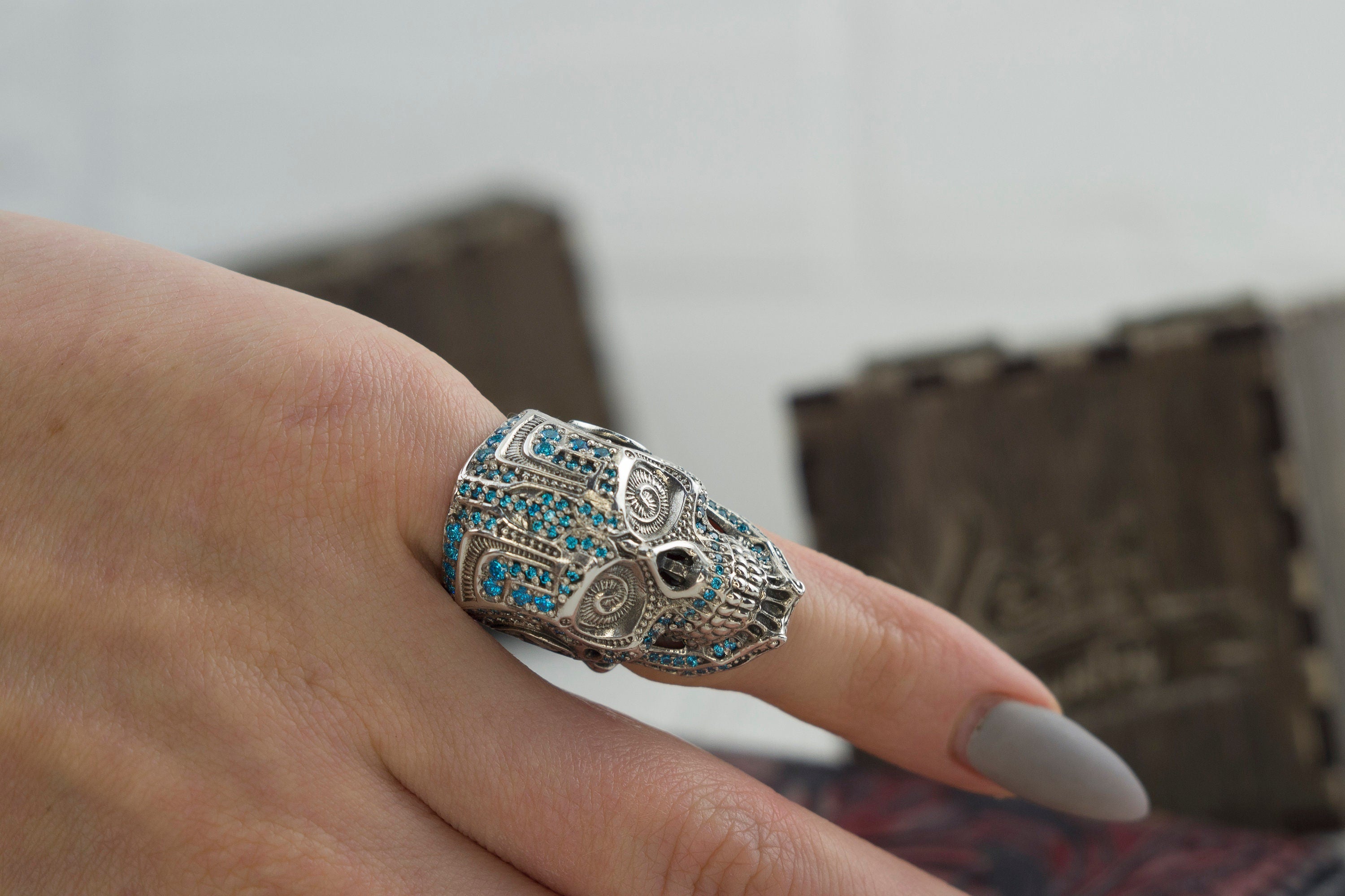 925 sterling silver Mexican-inspired sugar skull ring with blue cubic zirconia details
