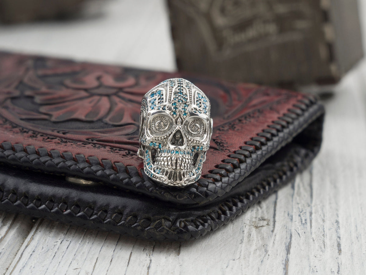 925 sterling silver Mexican-inspired sugar skull ring with blue cubic zirconia details