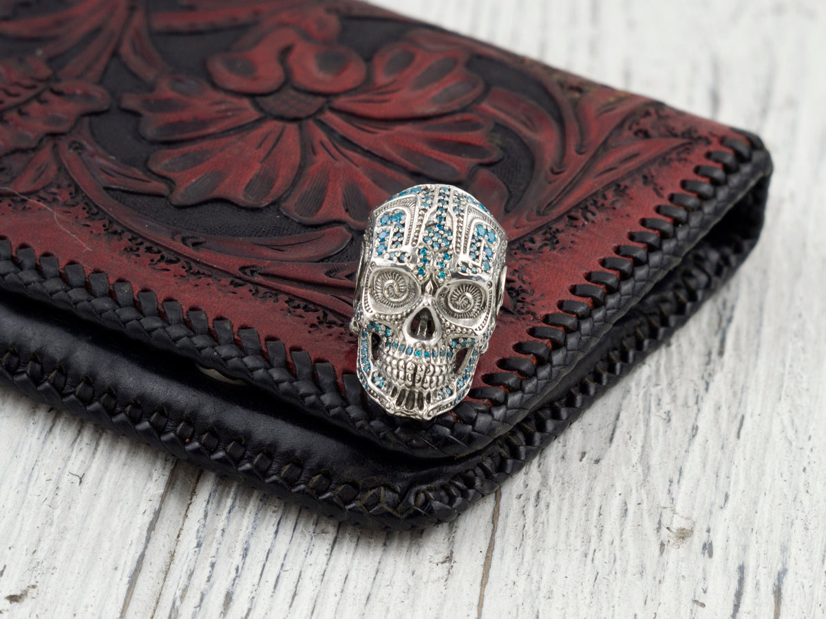 925 sterling silver Mexican-inspired sugar skull ring with blue cubic zirconia details