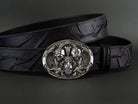 Hear Nothing See Nothing Say Nothing belt buckle in sterling silver 925 featuring sculpted skulls, ornate scrollwork, and red cubic zirconia accents on a black leather belt.