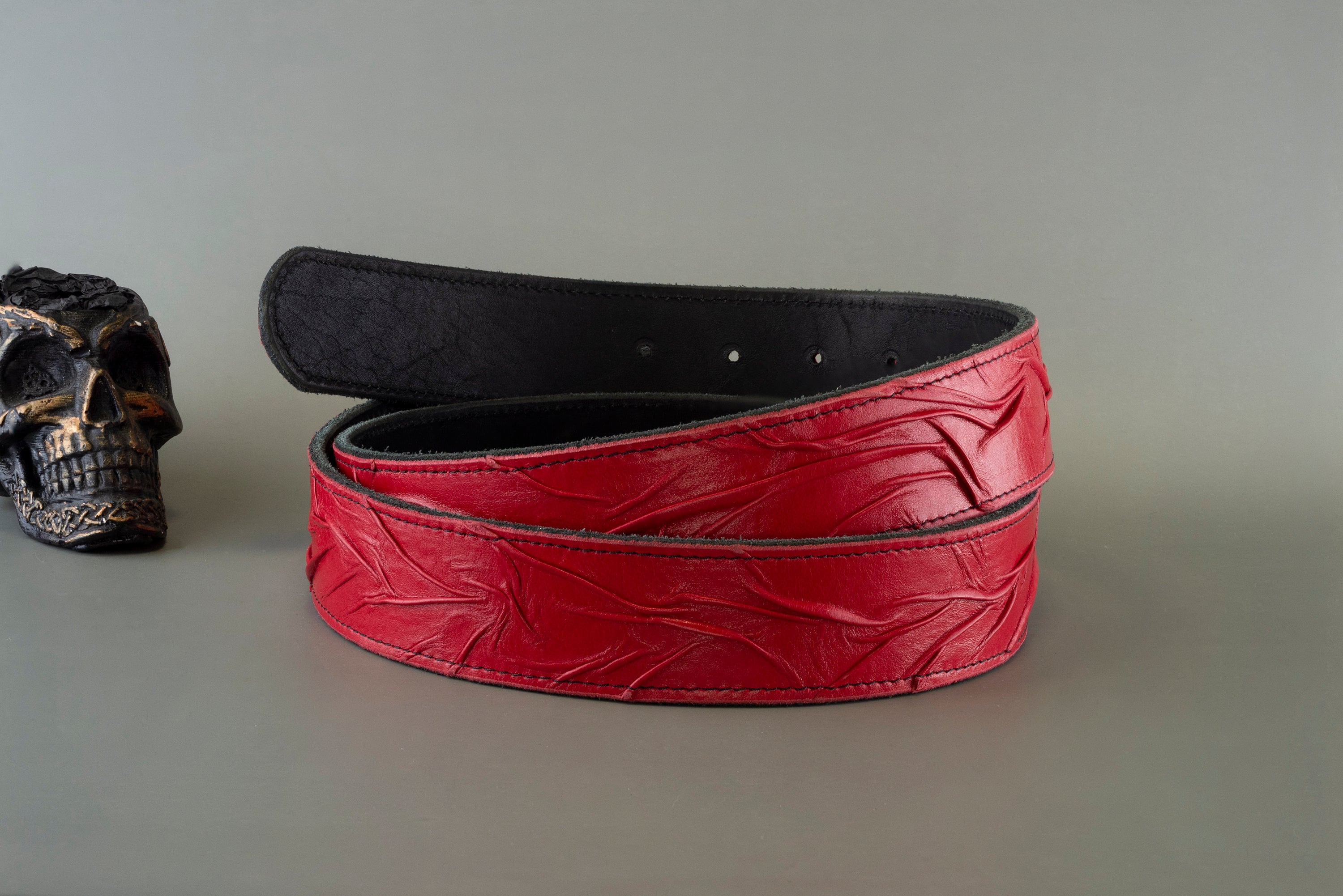 Handmade red genuine leather belt strap with embossed textured design, two-layer construction and 38 mm width