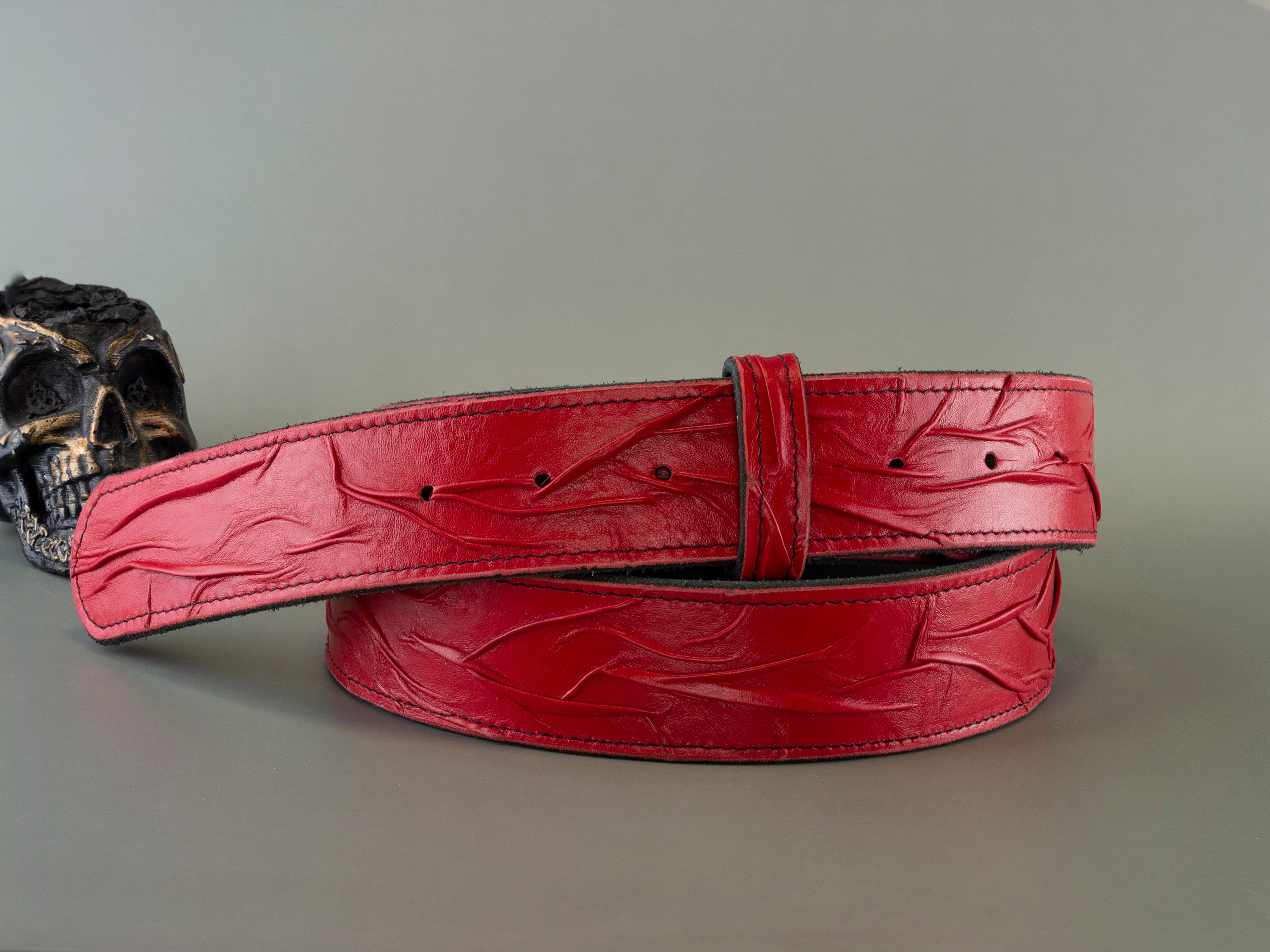 Handmade red genuine leather belt strap with embossed textured design, two-layer construction and 38 mm width