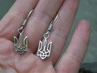 Close-up of minimalist 925 sterling silver Tryzub earrings showing the openwork Ukrainian trident design