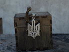 Oxidized 925 sterling silver Ukrainian Tryzub pendant with an integrated sword, 36 mm tall