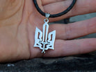 Oxidized 925 sterling silver Ukrainian Tryzub pendant with an integrated sword, 36 mm tall