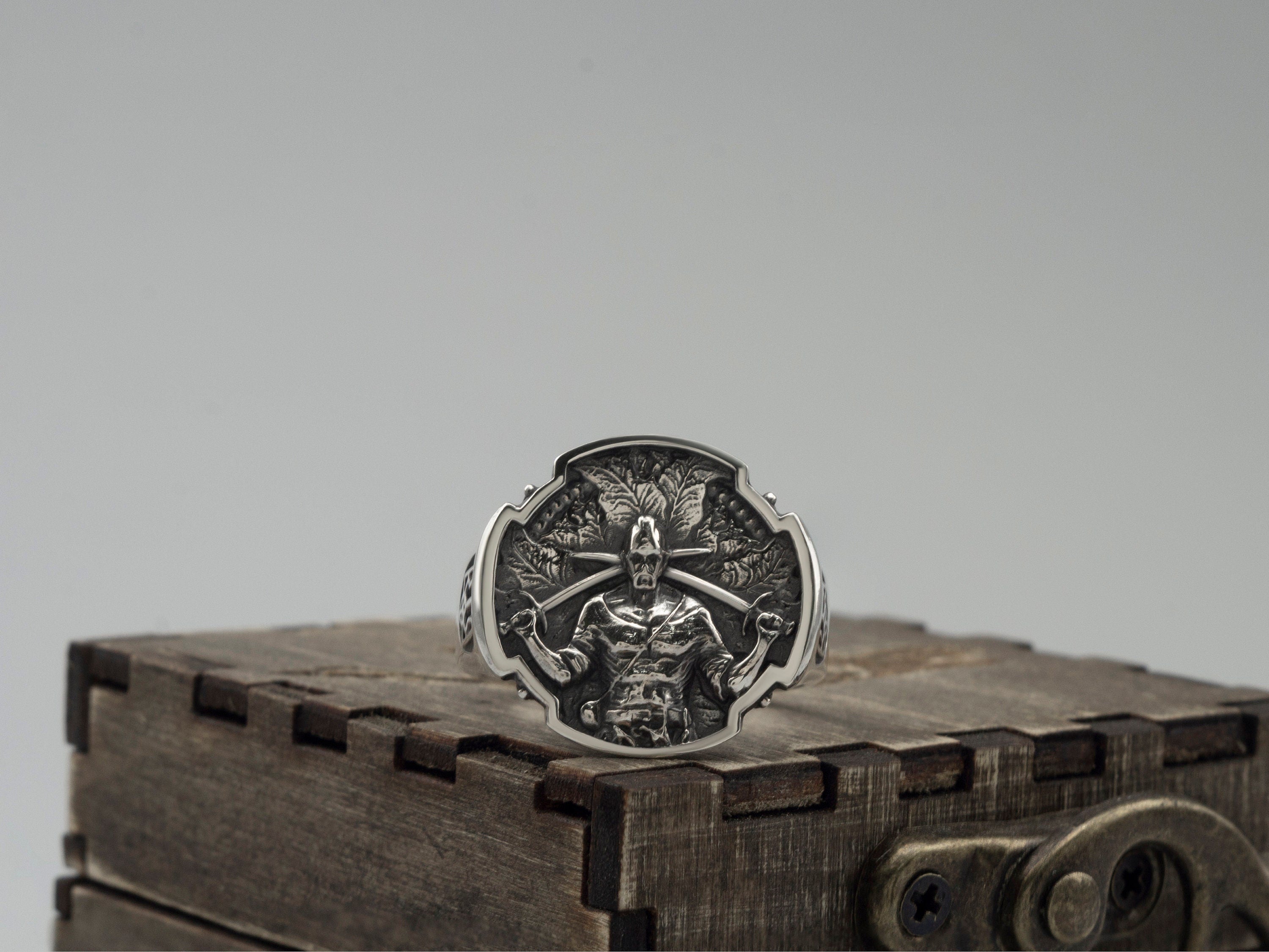 Ukrainian Warrior ring in 925 sterling silver featuring a detailed warrior relief, dark oxidized background, and polished ornamental border.