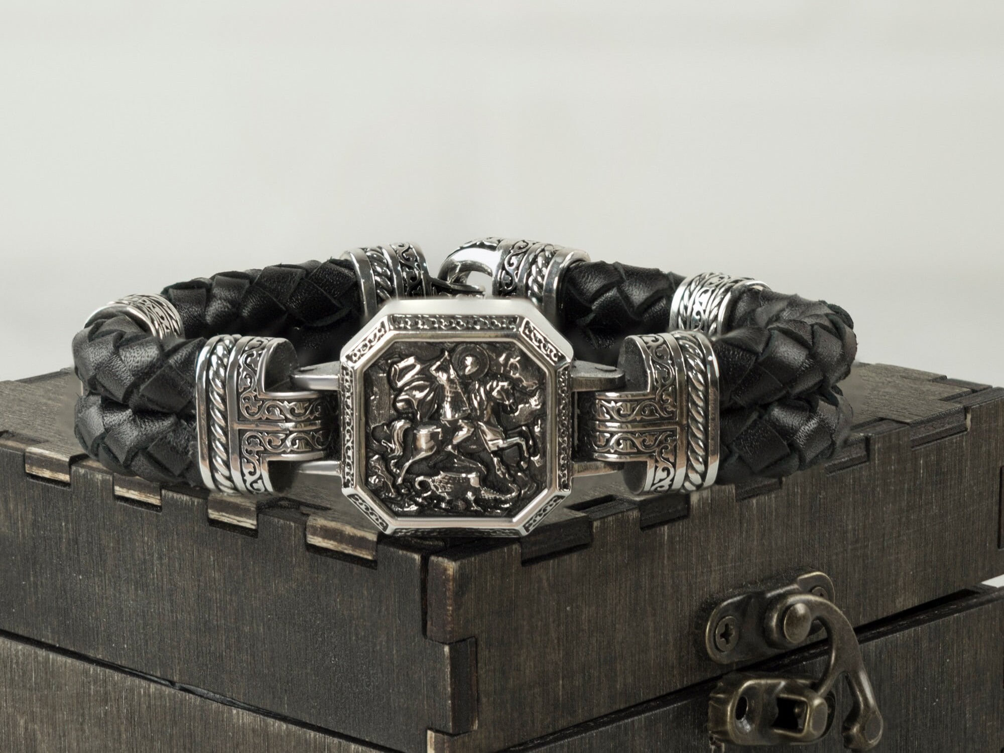 Saint George and the Dragon bracelet with 925 sterling silver centerpiece and braided black leather band
